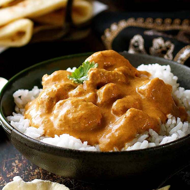 Butter Chicken served over basmati rice in a bowl, ready to be served
