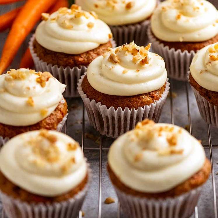 Carrot Cake Cupcakes with Cream Cheese Frosting on a rack, ready to be served