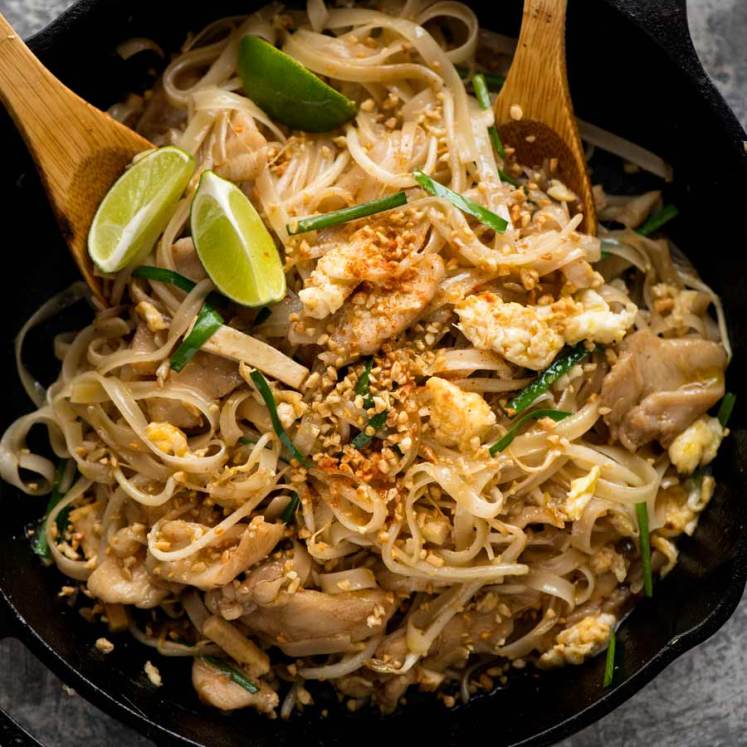 Chicken Pad Thai in a black skillet, fresh off the stove, ready to be served.