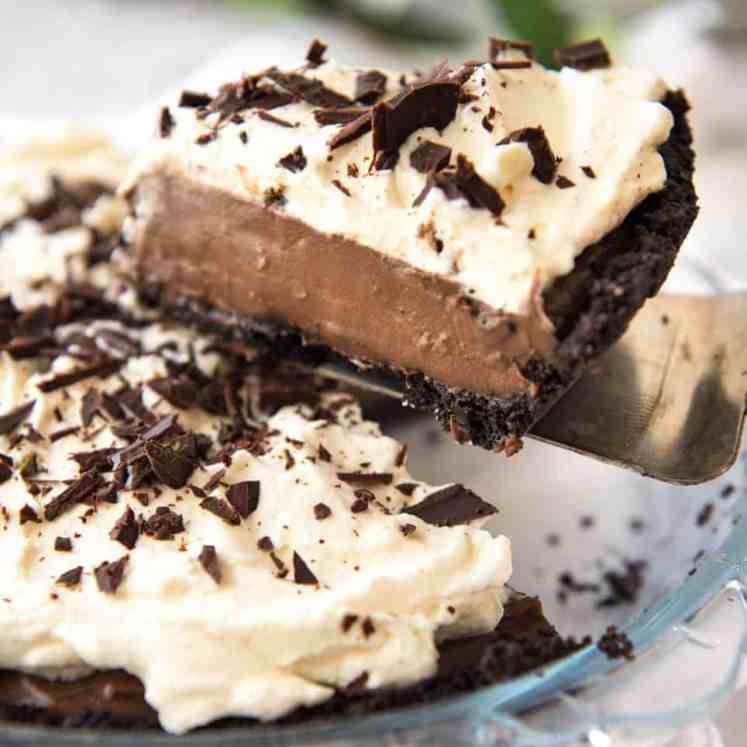 And easy, magnificent Chocolate Cream Pie with a biscuit base, soft custard-like chocolate filling and topped with clouds of cream. Recipe video included! recipetineats.com