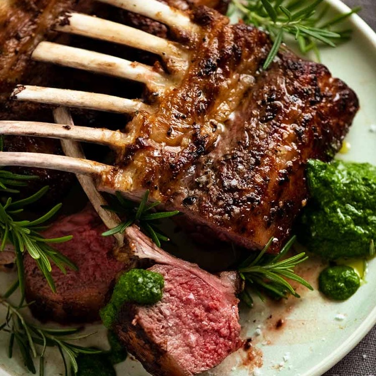 Rack of lamb on a plate with salsa verde
